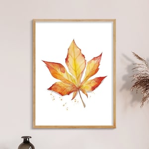 May include: A watercolor painting of a single orange and yellow leaf with a white background. The leaf has a detailed vein pattern and is slightly curled at the edges. The painting has a few small splatters of orange paint around the leaf.