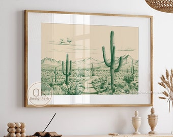 May include: A framed print of a desert landscape with a path leading through the center. The print features a green cactus in the foreground and a mountain range in the background. The print is hanging on a wall in a room with a wooden table and chairs.