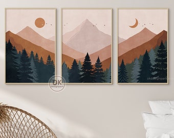 May include: Three abstract landscape prints with a mountain range, trees, and a sun, moon, or crescent moon in the sky. The prints are in a minimalist style with muted colors of brown, orange, and blue.