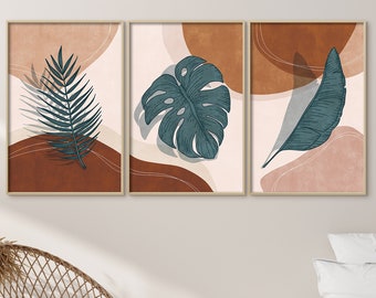May include: Three abstract art prints with a minimalist design featuring tropical leaves in shades of green on a background of brown, pink, and white.