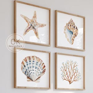 May include: Four framed watercolour prints of marine life, including a starfish, seashell, and coral, hang above a bed with blue and cream bedding. The prints are in square, light wood frames. The text "DIGITAL DOWNLOAD OKDesignPark.Etsy.com" is in the upper right corner.