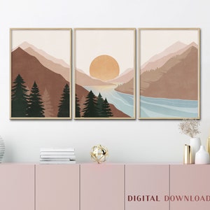 K&ouml;nnte beinhalten: Ein Set aus drei digitalen Drucken, die eine minimalistische Landschaft mit Bergen, einem See und einer untergehenden Sonne zeigen. Die Drucke sind in Braun-, Beige- und Blaut&ouml;nen gehalten.
