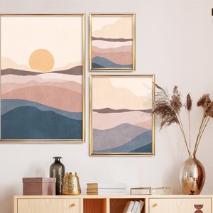 May include: Three framed art prints with a minimalist landscape design. The prints feature a warm color palette of peach, blue, and brown hues, with a golden frame. The text "DIGITAL DOWNLOAD" is visible in the upper right corner.