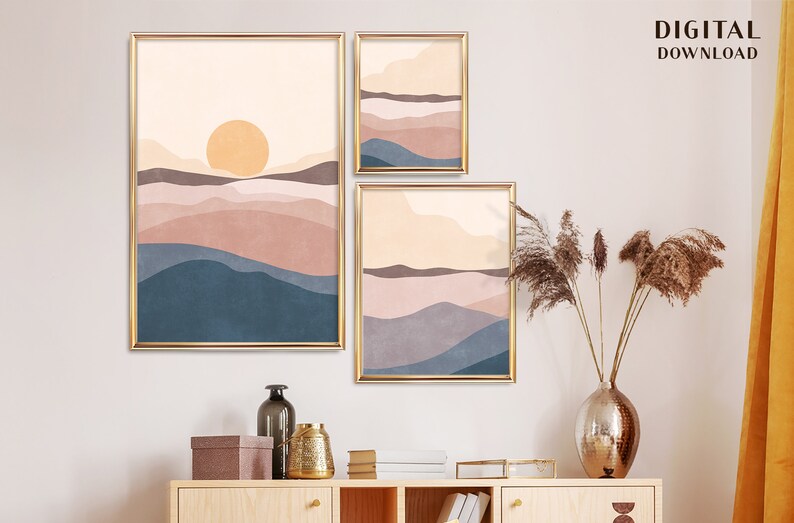 May include: Three framed art prints with a minimalist landscape design. The prints feature a warm color palette of peach, blue, and brown hues, with a golden frame. The text "DIGITAL DOWNLOAD" is visible in the upper right corner.