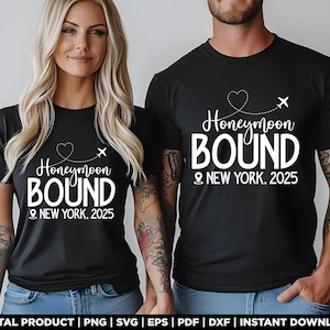 May include: Two black t-shirts with white text that says "Honeymoon Bound" and "New York, 2025". The shirts feature a heart and a plane icon.