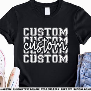 May include: Black t-shirt featuring the word "CUSTOM" in a stacked design, with "custom" in cursive in the middle. White trainers and blue jeans are visible. The design is for a personalized custom text.