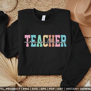 May include: Black sweatshirt with the text "TEACHER mrs. william" in rainbow colours.