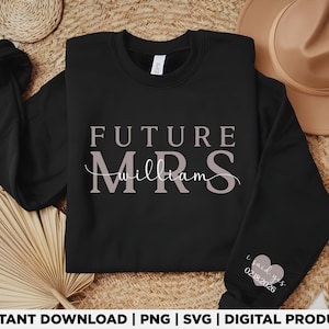 May include: Black sweatshirt with the text "FUTURE MRS William" in a light mauve color. The sleeve features a heart graphic with the text "I said yes 02.18.2026". A perfect gift for a bride-to-be.