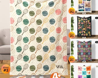 May include: A cream white throw blanket featuring a repeating pattern of tennis rackets and tennis balls in shades of green, blue, pink, and tan. The blanket includes the Viv Trek logo in the bottom right corner and text stating Custom Text Available.