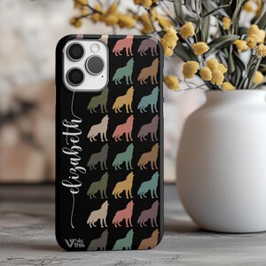 May include: A black smartphone case featuring a repeating pattern of howling wolves in muted tones of pink, teal, yellow, and brown. The name Elizabeth is printed in white cursive script vertically along the left side, with the Vivtrek logo at the bottom.