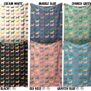 May include: Six rectangular blankets featuring a repeating pattern of small dachshund silhouettes in various colors. The blankets are displayed in six colorways labeled as Cream White, Marble Blue, Spanish Green, Black, Old Rose, and Grayish Blue.