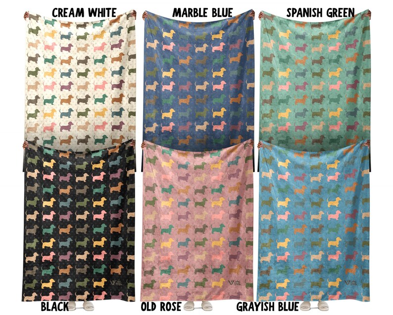 May include: Six rectangular blankets featuring a repeating pattern of small dachshund silhouettes in various colors. The blankets are displayed in six colorways labeled as Cream White, Marble Blue, Spanish Green, Black, Old Rose, and Grayish Blue.