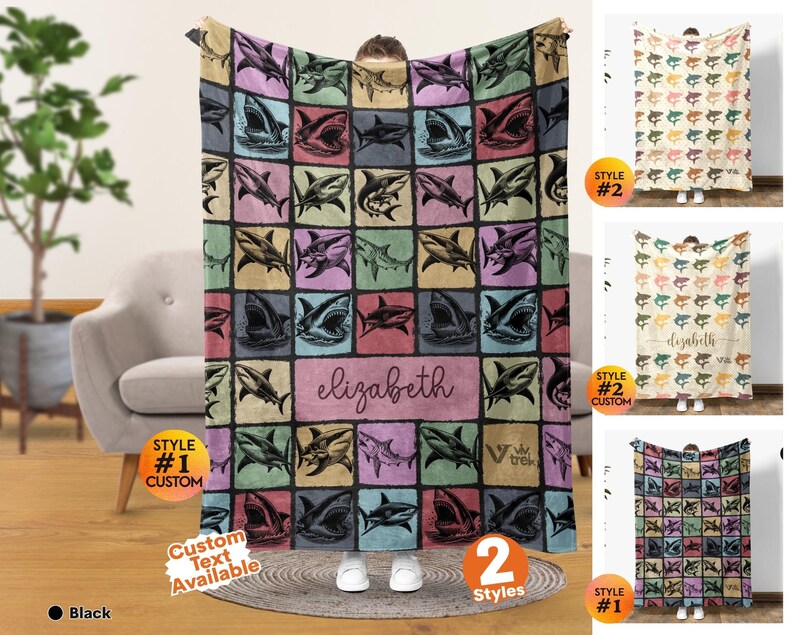 May include: A rectangular throw blanket featuring a grid pattern of various shark illustrations in shades of blue, pink, yellow, and black. The center includes a rectangular panel with the name elizabeth in cursive script and a logo for viv trek.