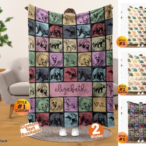 May include: A rectangular throw blanket featuring a grid pattern of various bear illustrations in shades of pink, green, blue, and tan. The center of the blanket displays the name elizabeth in cursive script. The design includes a logo with the text viv trek.