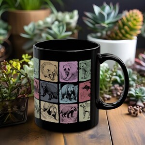 May include: Black ceramic mug with a colorful illustration of badgers. The mug has a white interior and a black handle.