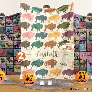 May include: A soft fleece blanket featuring a repeating pattern of bison silhouettes in various colors including teal, mustard, pink, and brown. The center displays the name Elizabeth in cursive script, with the text Custom Text Available.