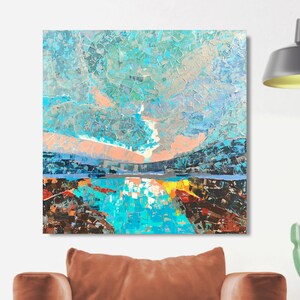 May include: Abstract painting of a landscape with a blue sky, pink clouds, and a turquoise lake. The painting is done in a textured style with visible brushstrokes.