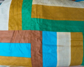 Hand-sewn patchwork blanket in geometric design