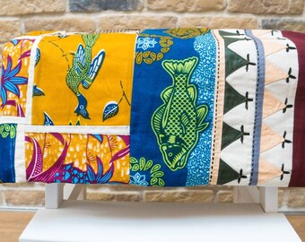 Hand-sewn colorful patchwork blanket in boho style