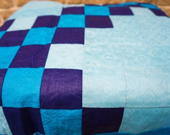 Hand-sewn patchwork blanket in geometric design in blue