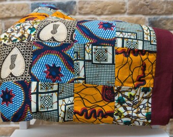Hand-sewn colorful patchwork blanket in boho style