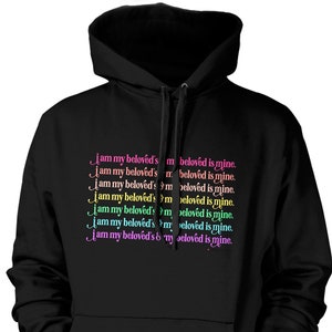 May include: Black hooded sweatshirt with the text "I am my beloved's and my beloved is mine." repeated in different colors.