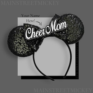 May include: Black sequined mouse ear headband with the words "Cheer Mom" in white script. The headband is black, and the ears are covered in shiny black sequins. The text "Your Name Here!" is above the "Cheer Mom" text.