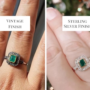 May include: A square emerald green gemstone ring with a halo of small diamonds. The ring is shown on a finger with two different finishes: vintage and sterling silver.
