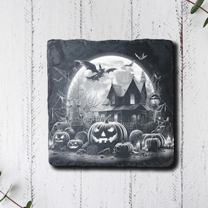 May include: Black and white illustration of a spooky house with a full moon and jack-o'-lanterns in front of it. The house has a pointed roof and windows with glowing lights. The jack-o'-lanterns have carved faces and are surrounded by cobwebs.