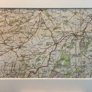 May include: A vintage map of the Worcestershire area in England, showing the towns of Worthing, Minsteley, and Pontesbury. The map is printed in black and white with red lines indicating roads and blue lines indicating rivers.