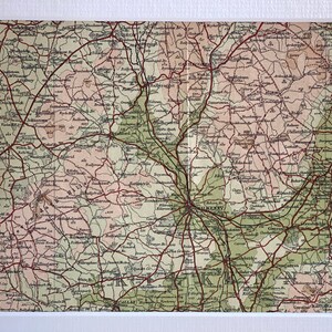May include: An antique map of Galway, Ireland, showing red roads and green fields. The map features surrounding towns and villages, including Ballinasloe, Tuam, and Athenry.
