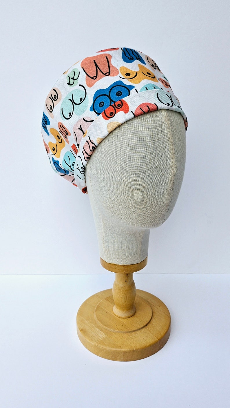 Modern Boob Print Surgical Scrub Hat, Colourful Rainbow Boobs Scrub Cap, Pull On Euro Style, Adjustable Tie Back Pixie Style. image 5