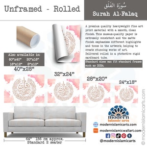 May include: A rolled print of the Surah Al-Falaq in Arabic calligraphy. The print features a pink and gold color scheme with a delicate watercolor background. The print is available in various sizes, including 40"x28", 32"x24", 28"x20", and 24"x18".