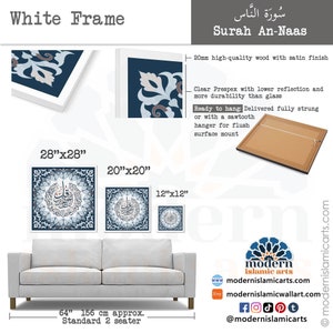 May include: A white framed canvas print of the Surah An-Naas in Arabic calligraphy with a blue and white geometric pattern. The print is available in three sizes: 28 inches by 28 inches, 20 inches by 20 inches, and 12 inches by 12 inches. The print is shown hanging above a white sofa.