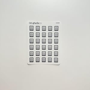 May include: A sheet of 49 black and white e-reader stickers. The stickers are arranged in a grid pattern and feature a simple outline of an e-reader.