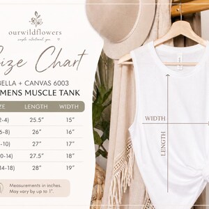 May include: A white muscle tank top hanging on a wooden hanger, with a size chart displayed to the left. The chart details measurements in inches for sizes S to 2XL. The text "ourwildflowers" is at the top.