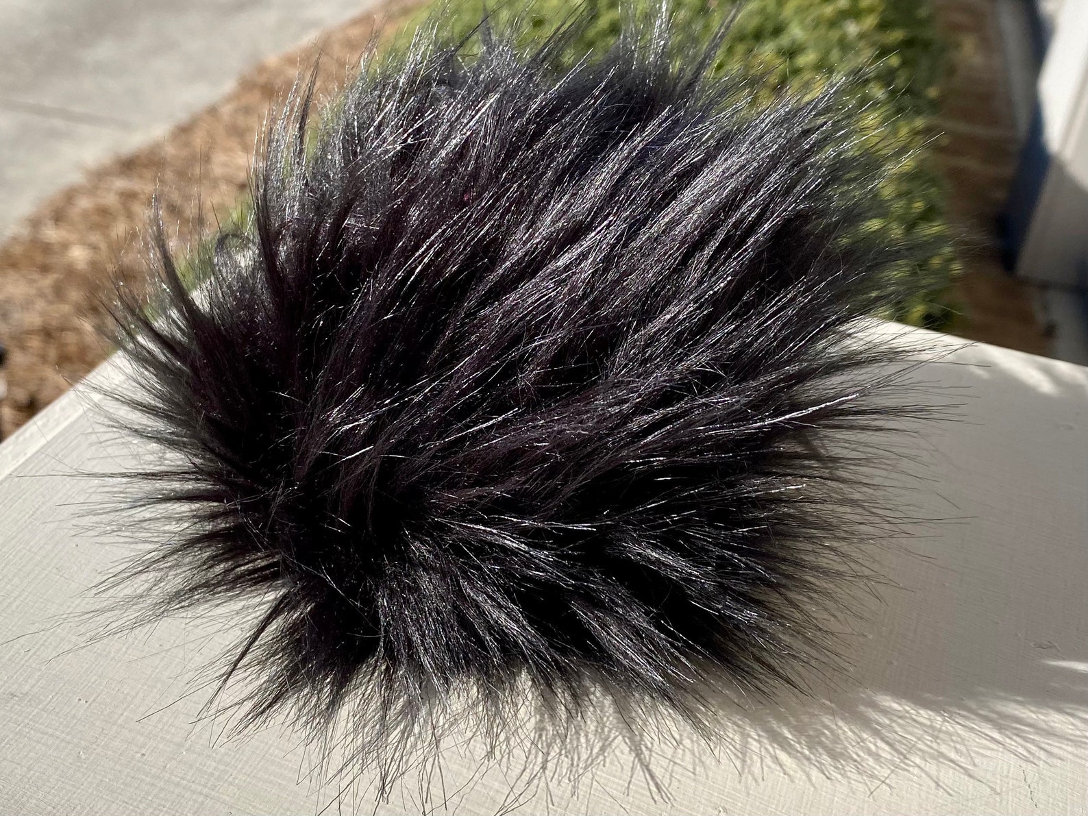 black fur pompom black fur pompom