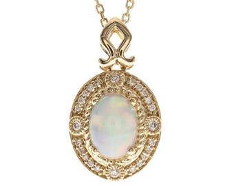 Classic Oval Cab Ethiopian Opal 14K Yellow Gold Diamond accents Pendant " by The Loupe club".