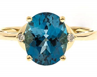 Classic London Blue Topaz 10K Yellow Gold Oval Cut With Diamond accents Ring "by The Loupe Club".