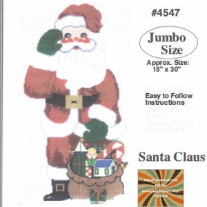 May include: A cross-stitch pattern for a Santa Claus with a bag of toys. The pattern is 15 inches by 30 inches and is labelled "Jumbo Size".
