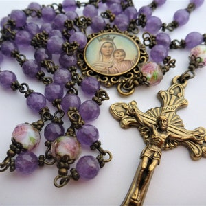 Rosary Our Lady of Mount Carmel, amethyst, faceted crystals, caps, spacers. Ornate medallion, Sunburst crucifix