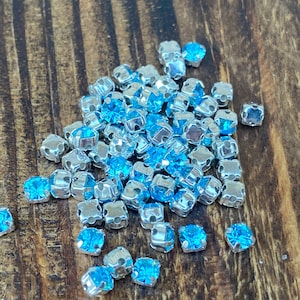 4mm Chatons Montees, Preciosa MC Chaton Maxima SS16/PP31 Crystal Aquamarine with silver cross setting, for beading, sewing, embroidery