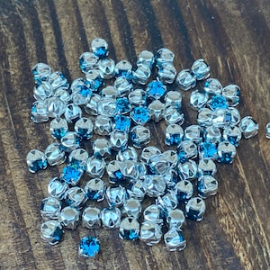 4mm Chatons Montees, Preciosa MC Chaton Maxima SS16/PP31 Crystal Indicolite with silver cross setting, for beading, sewing, embroidery