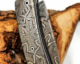 Folding knife entirely in mosaic damascus