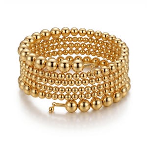 Pulsera de espiral chapada en oro de 14 quilates, brazalete/pulsera llamativa con múltiples filas de cuentas de bolas.