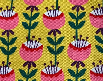 May include: A yellow fabric with a repeating pattern of pink flowers with red and white centers. The flowers have purple stems with green leaves.