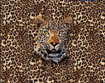 May include: A brown and black leopard print fabric with a close-up of a leopard's face in the centre. The fabric has a textured look and feel.
