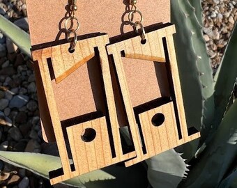 Guillotine earrings! Handmade out of Texas Cedar.