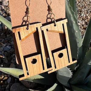 Guillotine earrings! Handmade out of Texas Cedar.