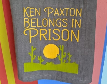 This little turd. Ken Paxton Belongs in Prison flour sack towel, now in gray!